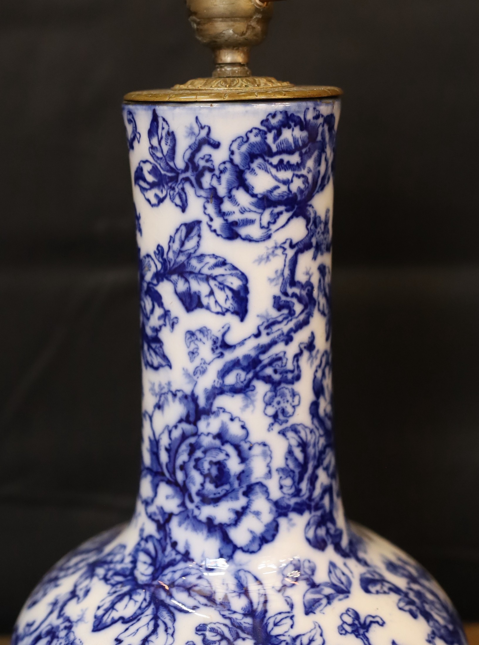 A Victorian mounted blue and white ceramic lamp base, height 38cm